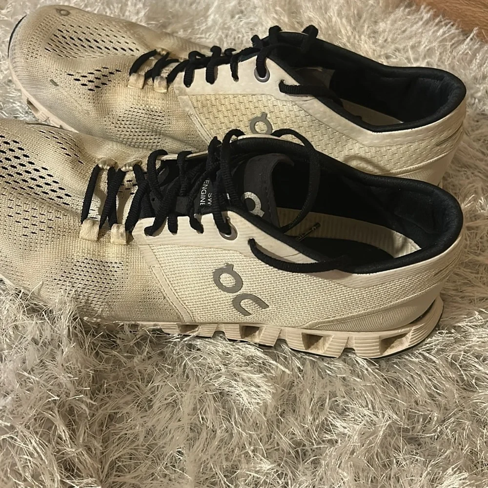On Running Black and Cream Athletic Shoes